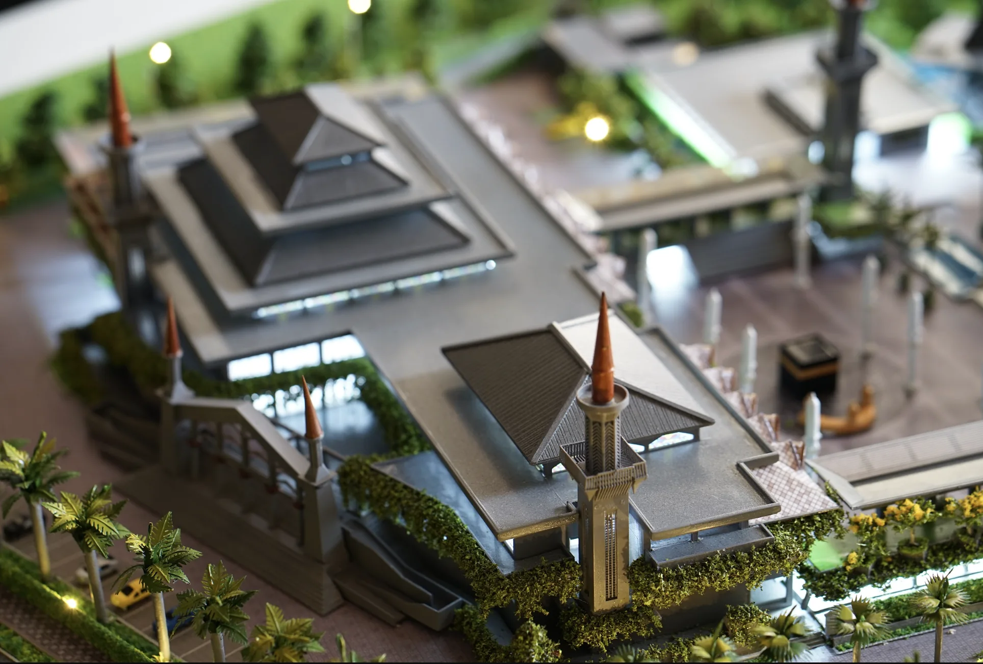 Illuminated Masjid Raya Bogor scale model with landscape and detailed mosque buildings.