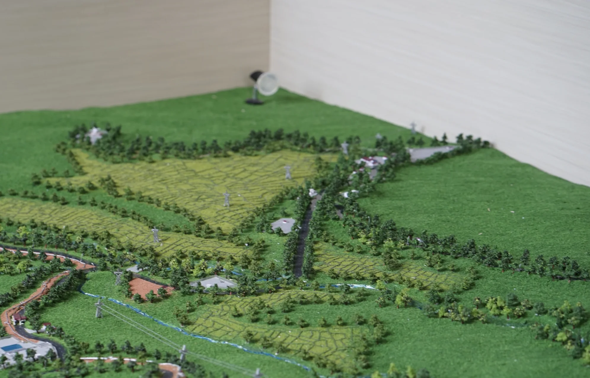 Contour, fields, road, river, and transmission detail in Muara Laboh terrain diorama.