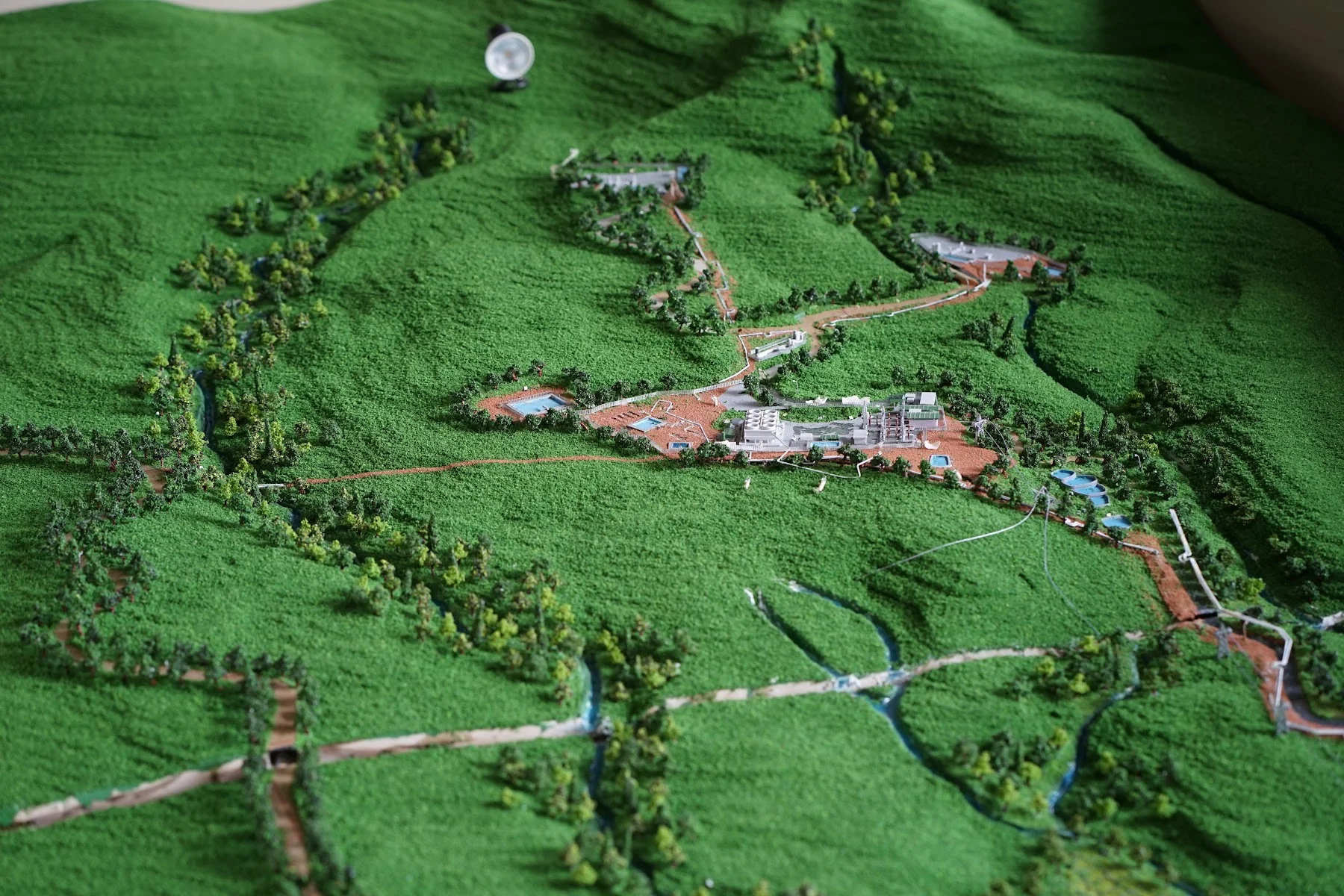 Power Plant Muara Laboh technical terrain diorama with facility, access road, river, and landscape.